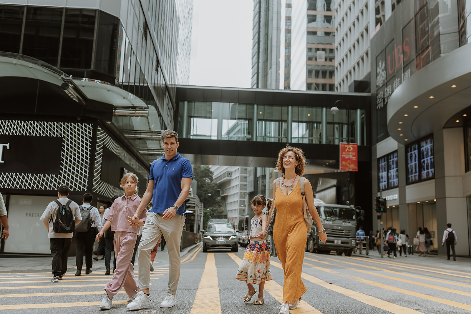 Natural light photo of a Hong Kong family laughing during a relaxed lifestyle session