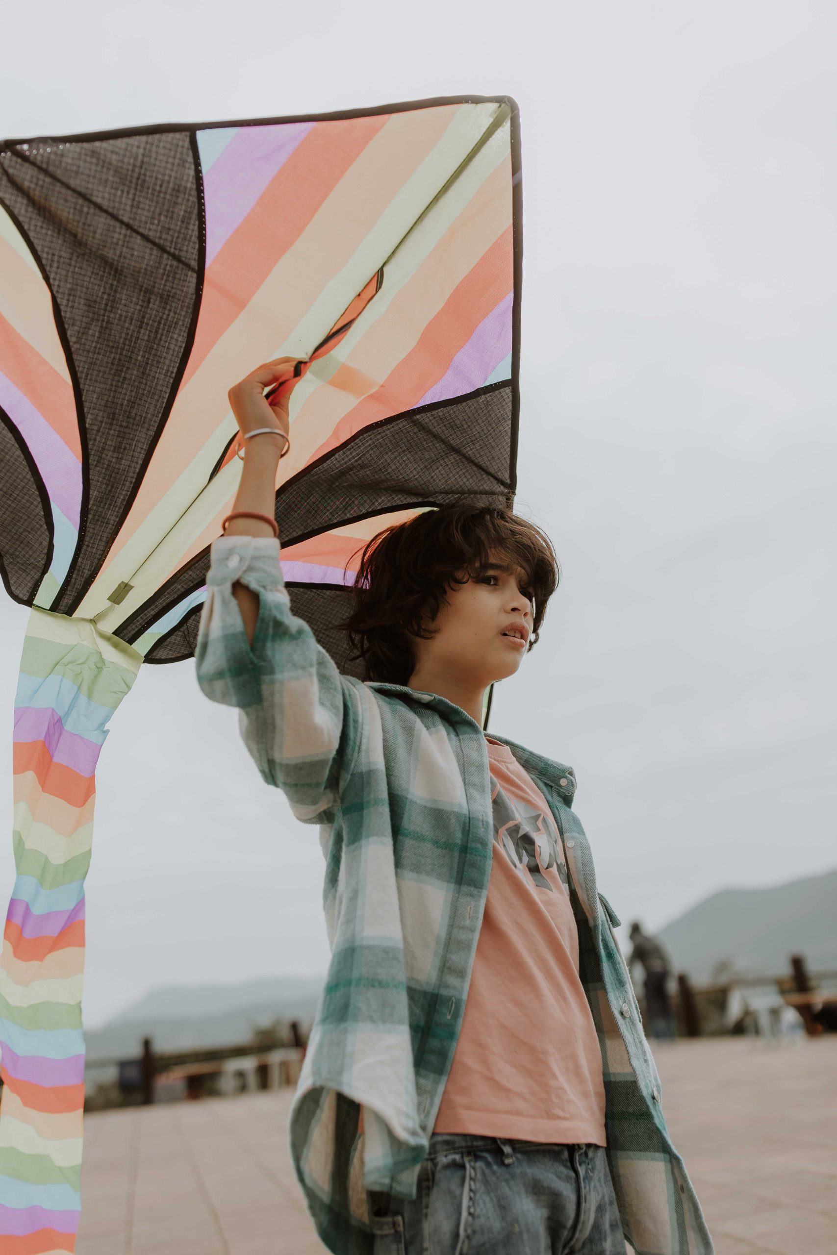 Young boy playing with a kite